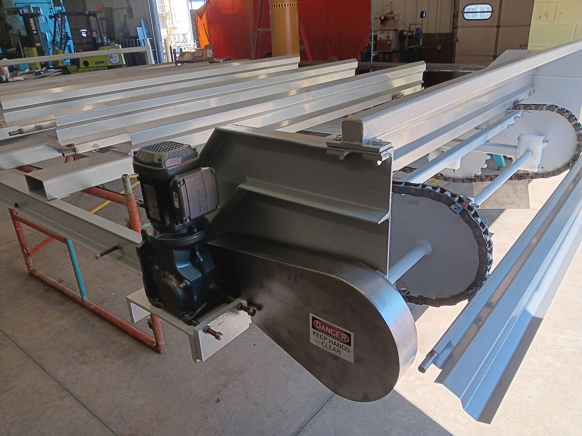 Chain-drive skimmer assembly on shop floor